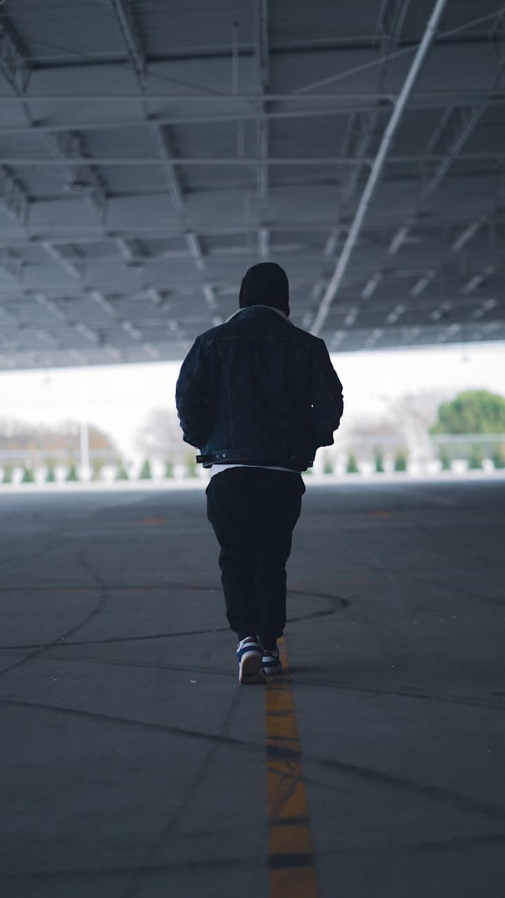 man walking on a parking