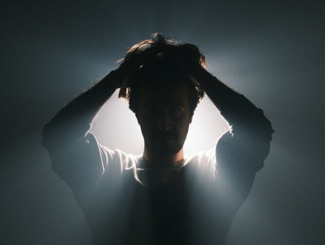 silhouette of a person with dramatic backlighting